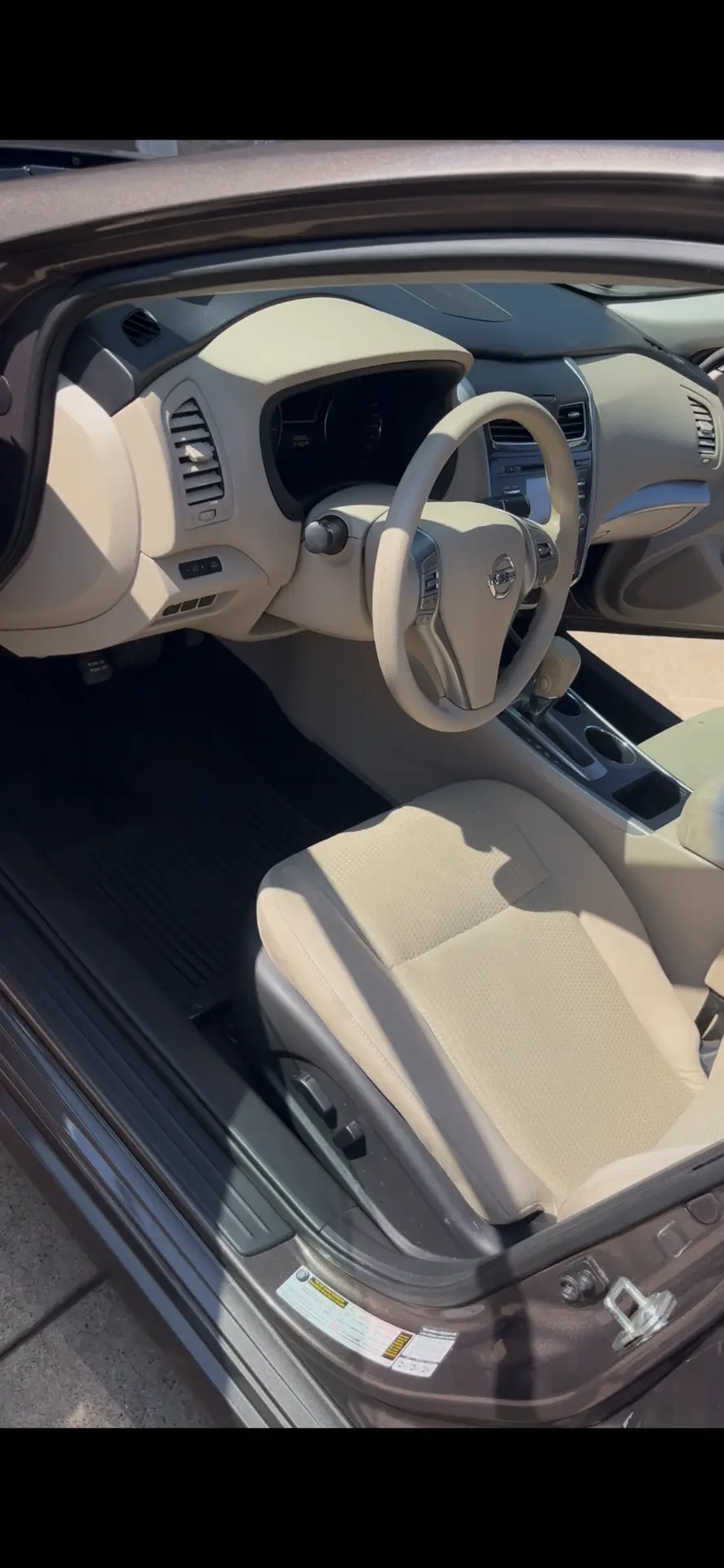 Same Nissan Altima interior spotless after a full interior detail