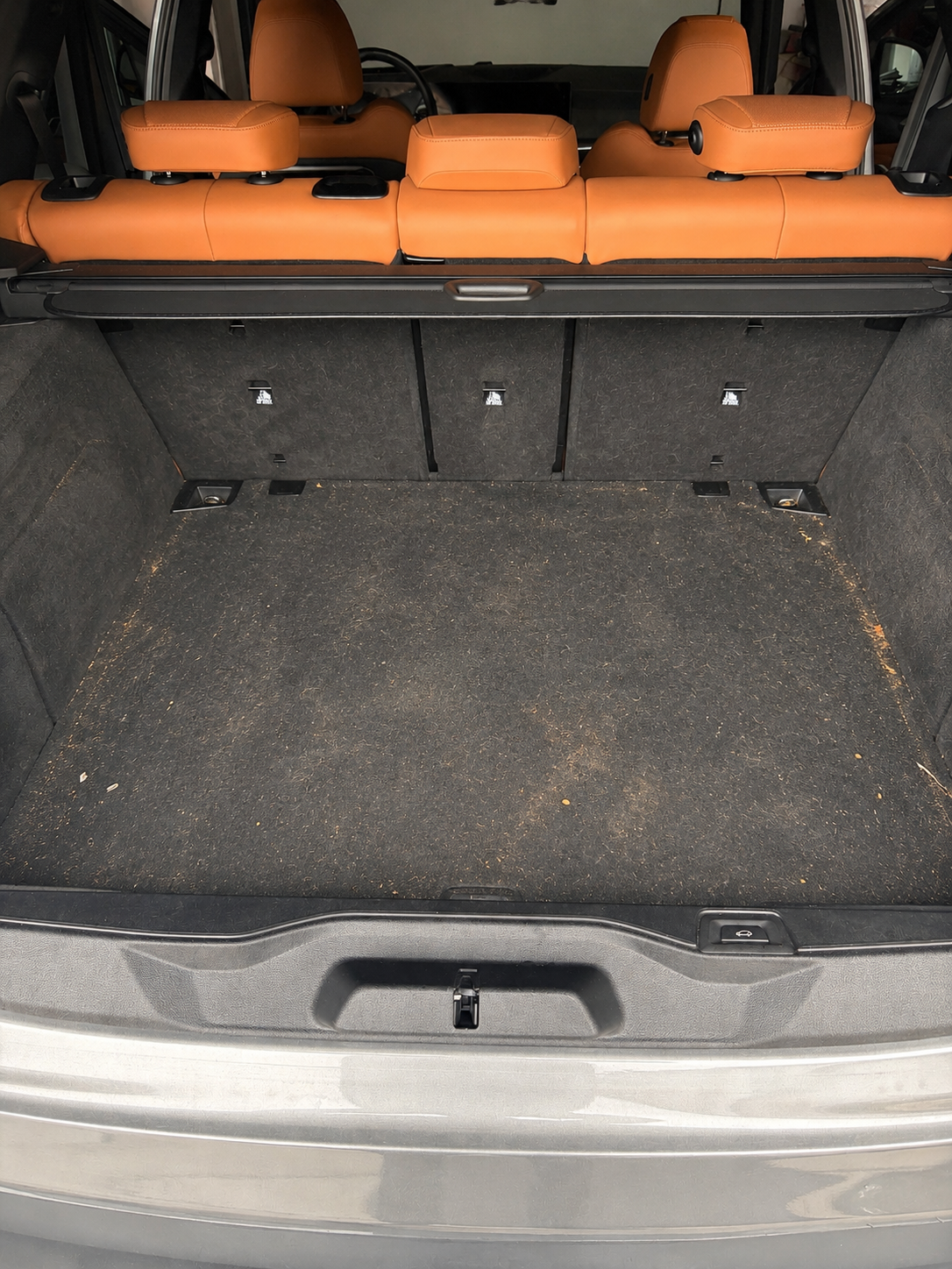 Porsche Macan GTS cargo area with dirt and debris before deluxe detail